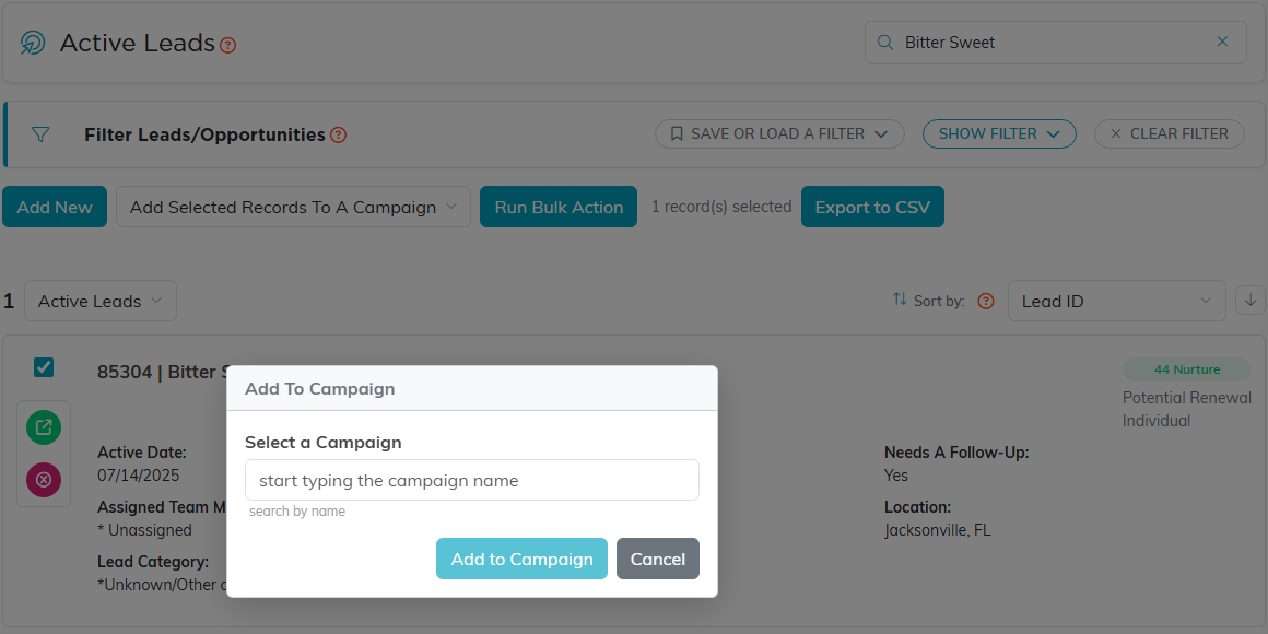 The leads list with one lead ticked, Add Selected Records To A Campaign chosen, and the Add To Campaign window open with a campaign search box